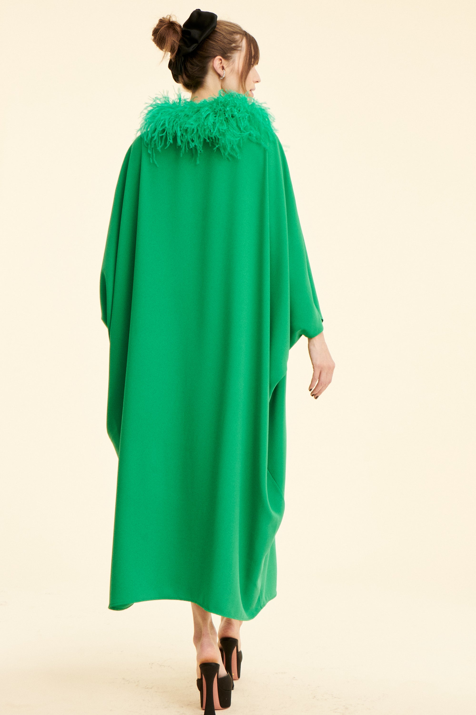 SAAHN model showcasing emerald green kaftan